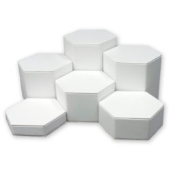White leatherette hexagonal display set of 6 pieces ranging 1.25 to 6.25 inch tall